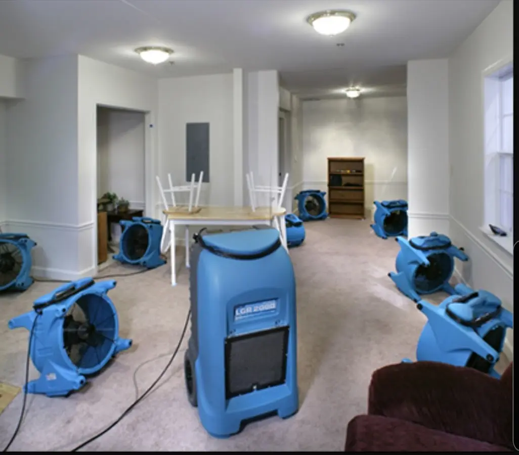 Air movers and dehumidifier setup for Water Damage Restoration in Kirby